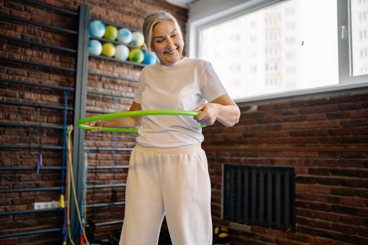 older-woman-exercises-with-hula-hoop-1200x800.jpg